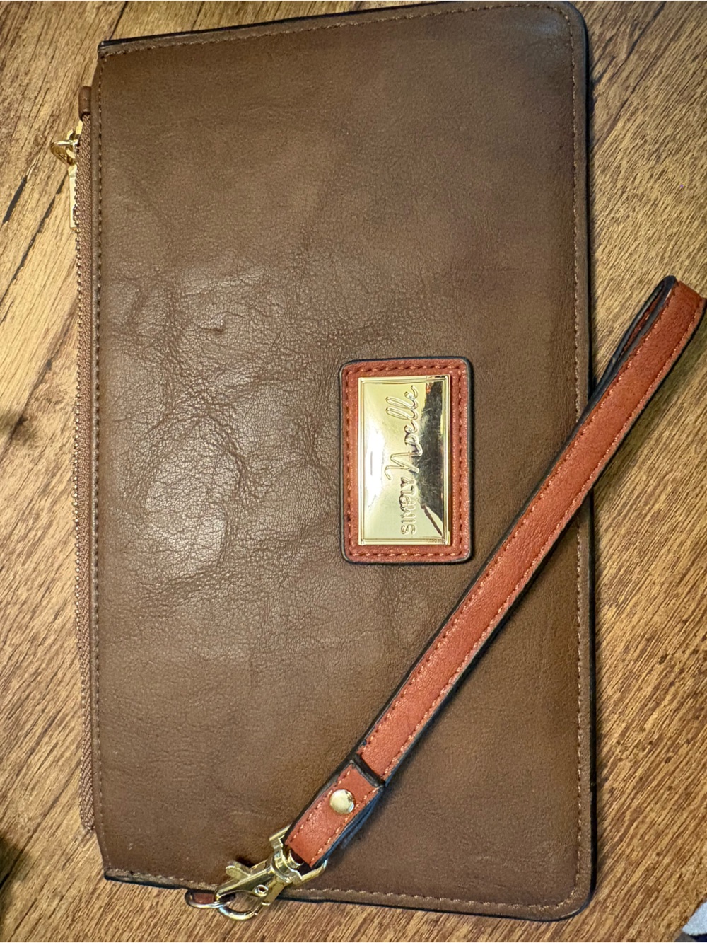Brown Leather Wristlet with Tan Strap & Gold tone hardware.